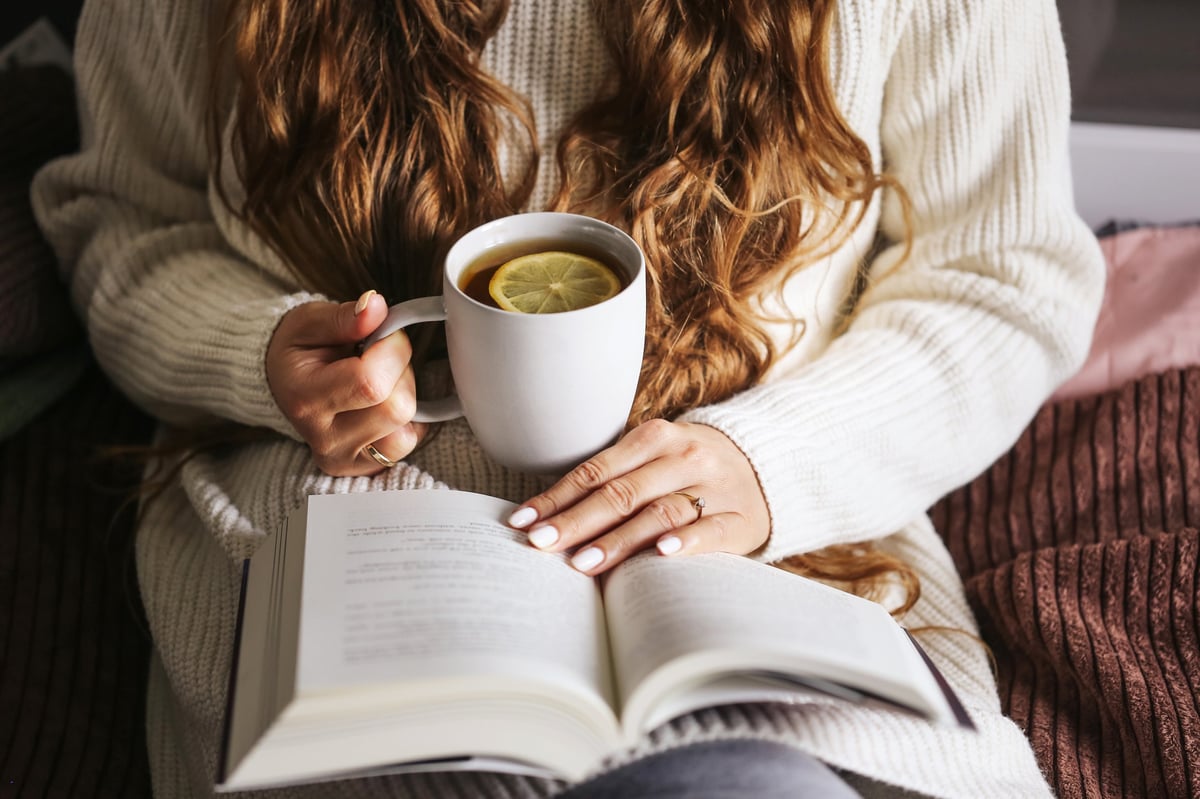 A warm, relaxed moment at home with a soft blanket, representing a calm and welcoming space to start a conversation